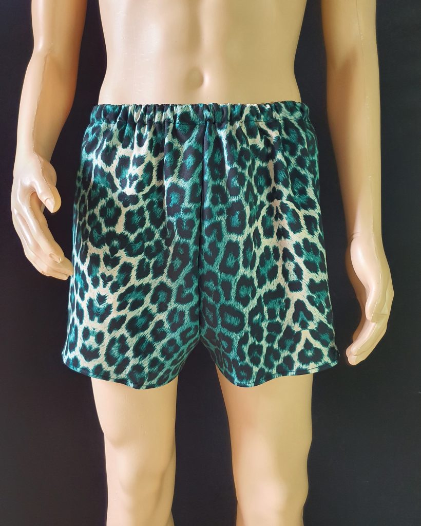 These unisex boxer shorts are made from comfortable, stretchy scuba fabric with a bold green leopard print